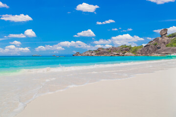 Beautiful sandy beach with wave crashing on sandy shore at Similan Islands.