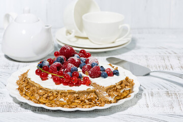 healthy sweet oatmeal cake with yoghurt and fresh berries