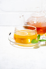 healthy tea for immunity with ginger, lemon and mint, vertical closeup