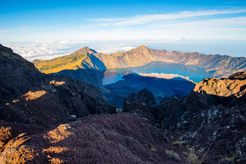 Mount Rinjani crater and a shadow cast from the peak at sunrise