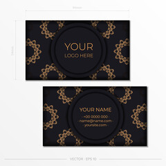 Fototapeta premium Black business card template with luxurious gold patterns. Print-ready business card design with vintage ornament.