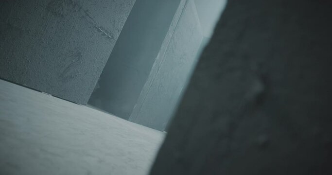 4K Side view of girl walking inside dark maze . Footage of mystic video of bride in labyrinth . Vision of mystical dream . Shot on ARRI ALEXA Cinema Camera in slow motion .