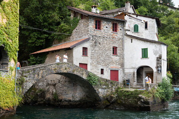 Fototapeta na wymiar Nesso is a small village on Lake Como, between Como and Bellagio, built on the homonymous ravine, a narrow rocky gorge where two streams meet, with a suggestive waterfall and a steep path. 