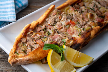 Traditional delicious Turkish food, meat pide (Turkish name; Kusbasi etli pide)