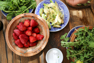 table prepared with healthy fruits and herbs