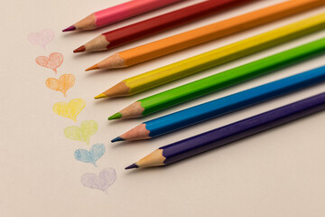 An album for drawing. Hearts drawn with colored pencils by a child. A declaration of love. Valentine's day.