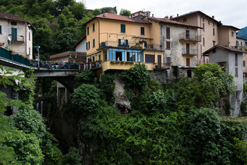 Fototapeta na wymiar Nesso is a small village on Lake Como, between Como and Bellagio, built on the homonymous ravine, a narrow rocky gorge where two streams meet, with a suggestive waterfall and a steep path. 