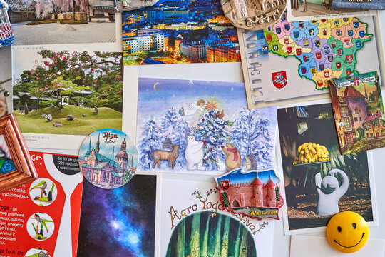 Collage of images, postcards, and magnets from various trips. 