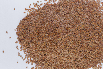 top view of linseed on white background, close up of a Brown flax seeds