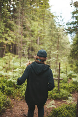 Woman runner in the forest. Endurance training with nature.