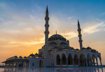Fototapeta na wymiar Sharjah, UAE - 07.31.2021 - Sharjah mosque at evening hour. Religion