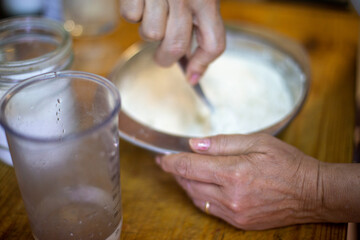 Obraz na płótnie Canvas person mixing dough