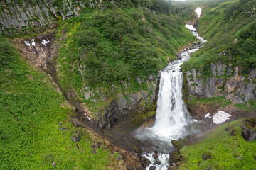 Fototapeta na wymiar The Calm Waterfall on Kamchatka Peninsula, Russia