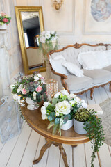 luluxury rich sitting room interior in beige pastel color with antique expensive furniture in baroque style. walls decorated with stucco and frescoes