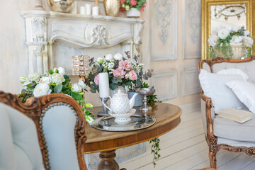 luluxury rich sitting room interior in beige pastel color with antique expensive furniture in baroque style. walls decorated with stucco and frescoes