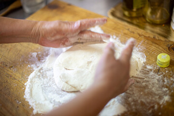 baker kneading dough