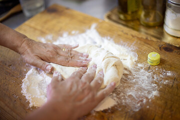 hands kneading dough