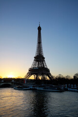 Eiffel Tower at sunrise by the Seine river, Paris, France