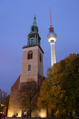 Obraz premium St. Mary's Church and the TV Tower in Alexanderplatz, Berlin