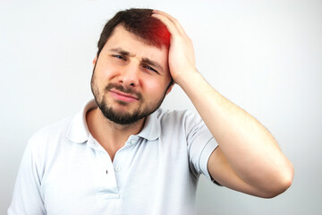 Handsome bearded man holding his head with his hand and suffering from headache or migraine on white background