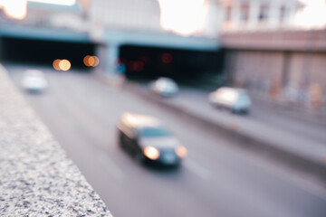 Blurred cityscape. View of the highway entering the tunnel. Abstract traffic background.