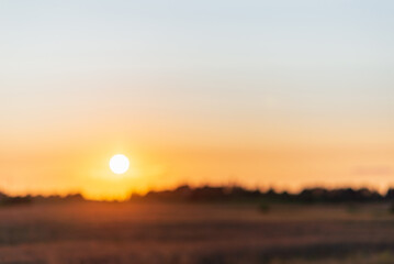 Blurred sunset landscape.Summer holiday concept. blurry beautiful sunlight and golden sunset background.