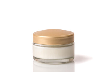 Cosmetic cream in a white jar. On a white isolated background.