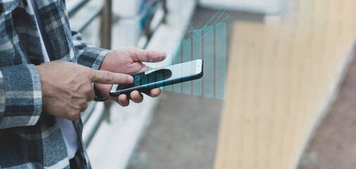 teen boy using smartphone device for online network technology internet;  man use mobile in public park