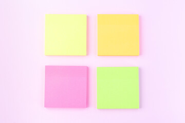 Empty colorful paper notes on pink background, horizontal