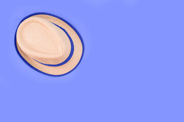 womens hat on blue background with copy space.