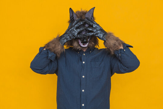A werewolf covering his eyes with his hands