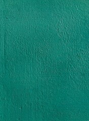 Green painted wall background texture.