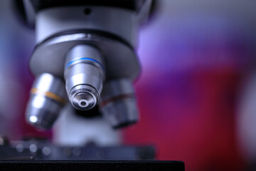 Close up shot of microscope lens and colorful blur background copy spae