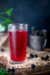 fruit juice of berries in a glass transparent glass