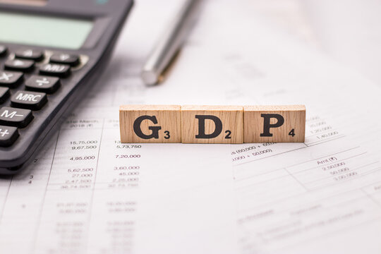 Assam, india - March 30, 2021 : Word GDP written on wooden cubes stock image.