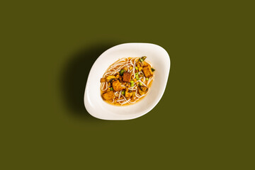 ramen noodles on dark green surface