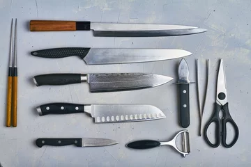 Fotobehang japanese knives on grey background top view © EVGENII
