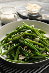 Bowl of tasty salad with green beans on table