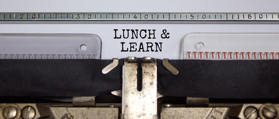 Lunch and learn symbol. Words 'Lunch and learn' typed on retro typewriter. Business, educational...