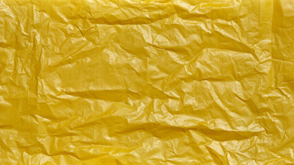 Crumpled Plastic Bag Texture, Yellow Creased Plastic Sheet, Abstract Shapes for Background.