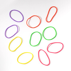 Group of multicolor rubber money bands isolated on white, round rubber band