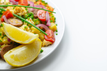 Haricot tomato bean sauce with turmeric potatoes, pork and herb sausage, and scrambled egg
