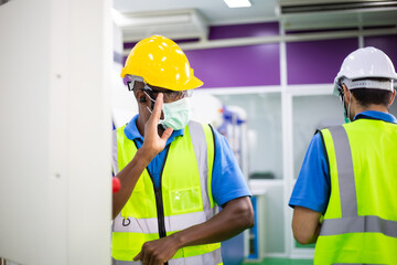 Male worker wearing mask greeting to colleague. working during epidemic. social distancing preventing sickness infection