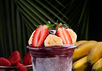 Acai cup with strawberry and banana topping