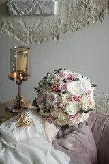 Stylish bridal bouquet of preserved flowers. Wedding bouquet of white and pink roses. Close up of wedding bouquet.