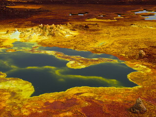Closeup of bright colorful sulphur springs and rock patterns forming a Mars like landscape Danakil Depression hottest place on earth Ethiopia