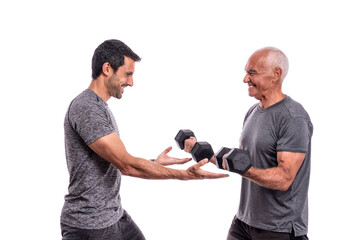  Old man with a personal trainer is conducting a fitness workout. Health and sports. On an isolated...
