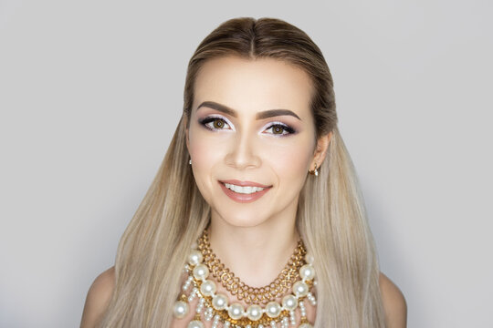 Beautiful woman skincare concept. Bright makeup shades shadows sequins. Perfect hairstyle brushed long straight hair. background horizontal banner. White teeth smile, whitening, tooth care new clinic