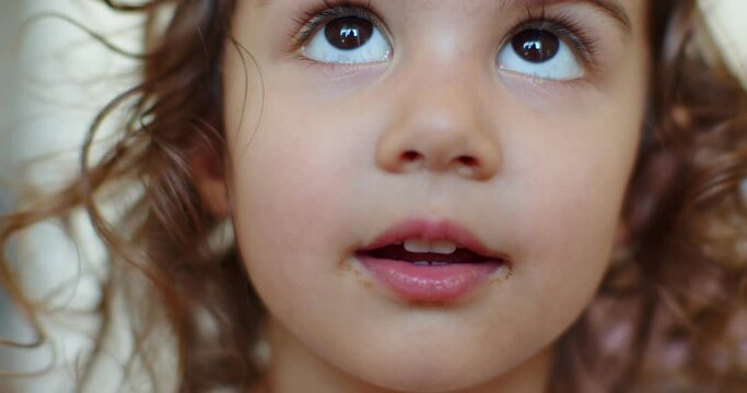 Closeup of a toddler girl with a messy face.
