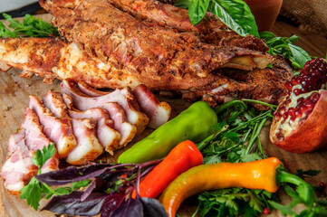 Steak on ribs,baked and served with color chili pepper. Wooden rustic background. Top view.